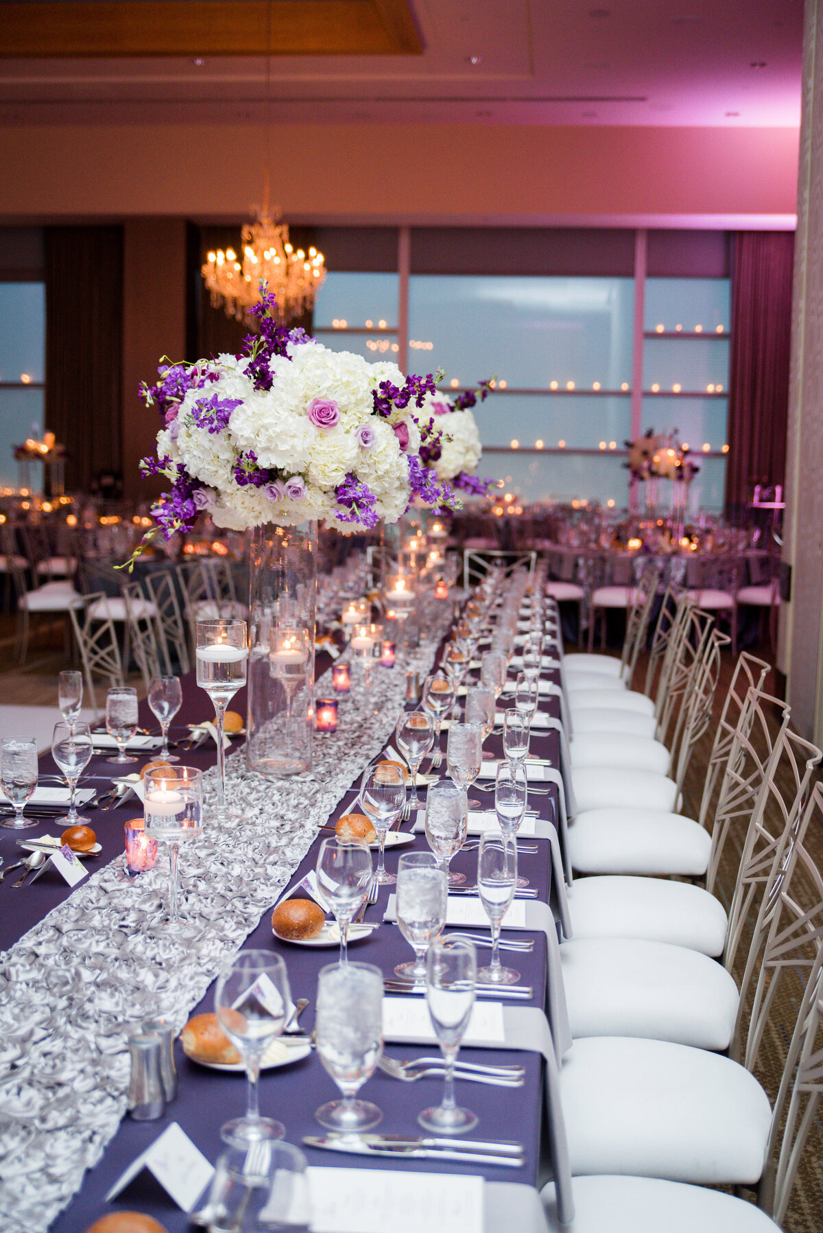 wedding reception setup with purple linens and candles at fairmont hotel