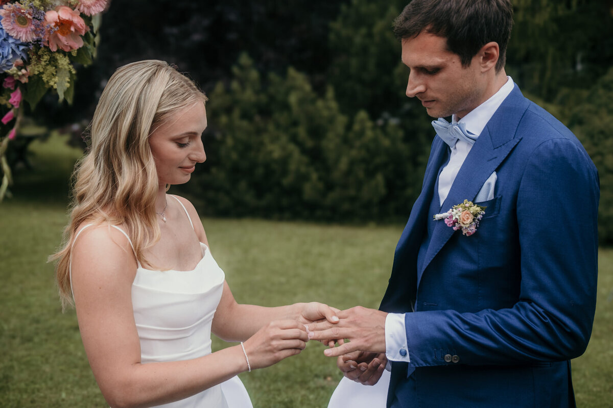 The moment of true love, where the bride puts the ring on her grooms' finger.