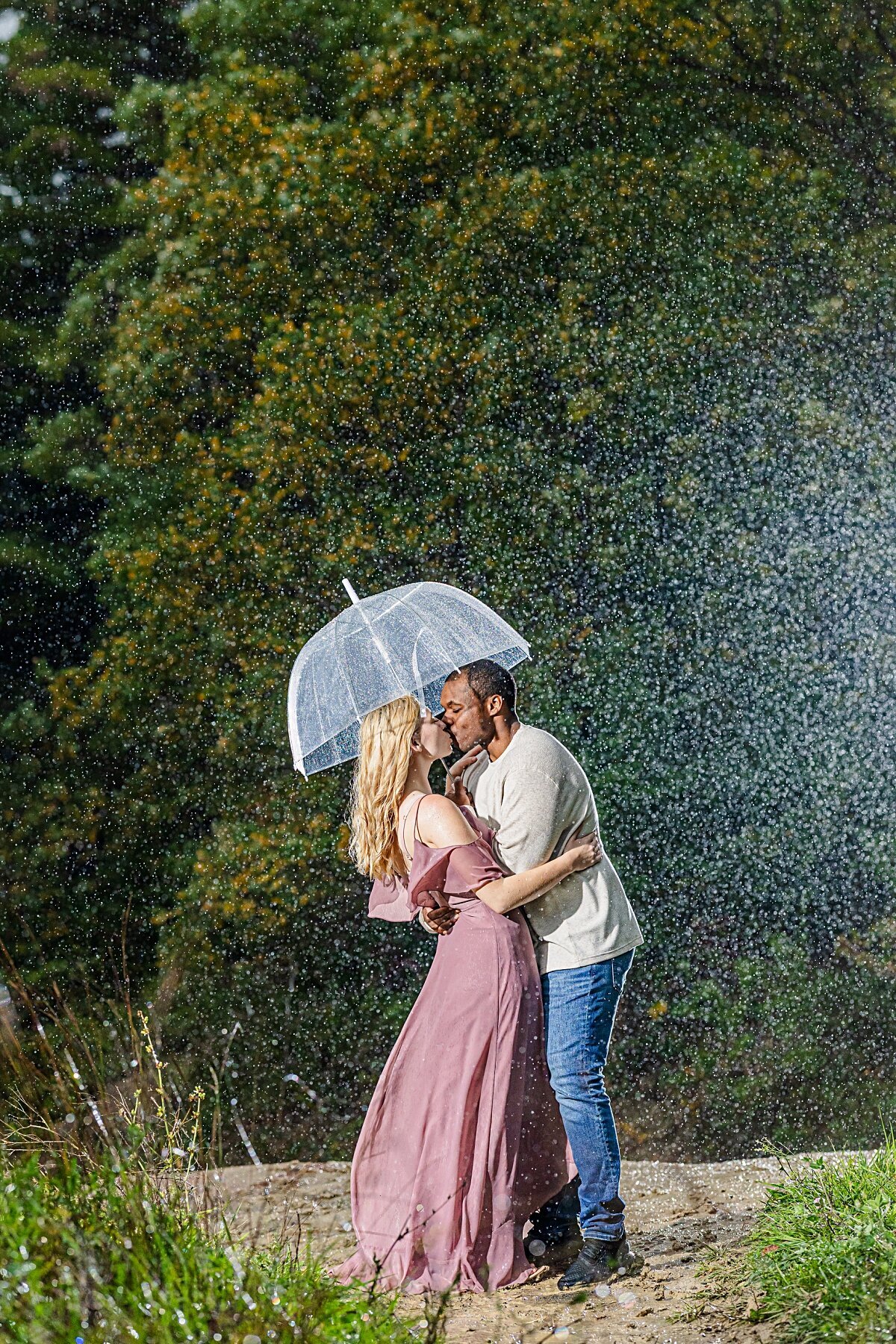 mixed-couple-kissing-in-the-rain-beards-hills
