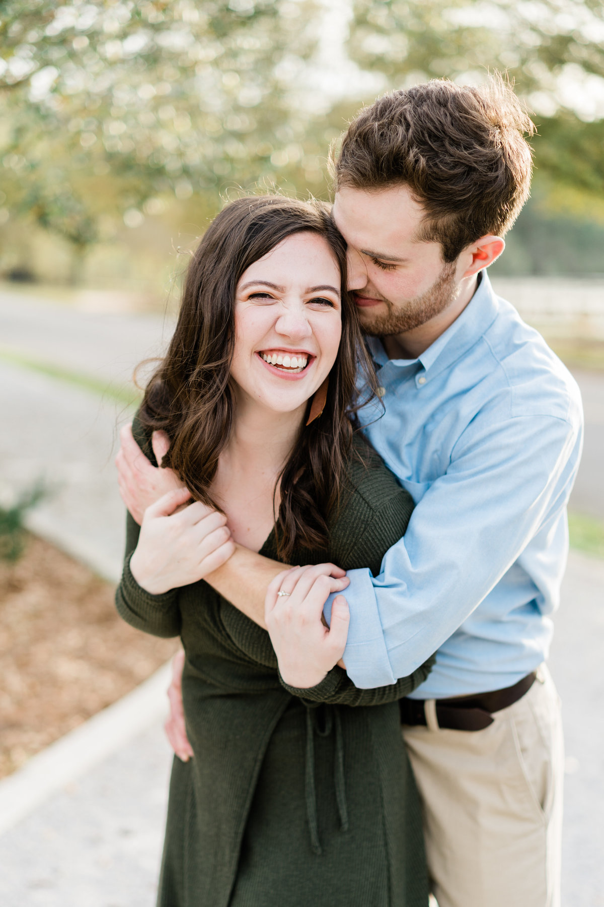Couple laughing during engagement photoshoot