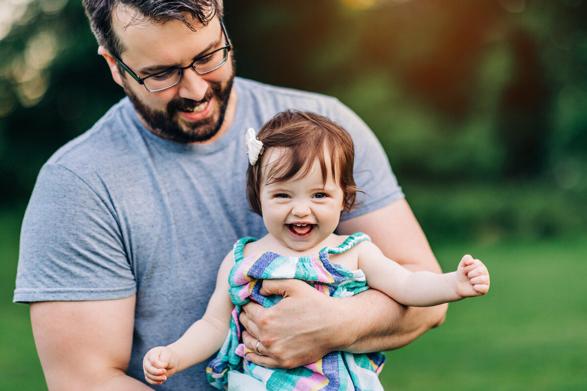 toddler-laughing-dads-arms