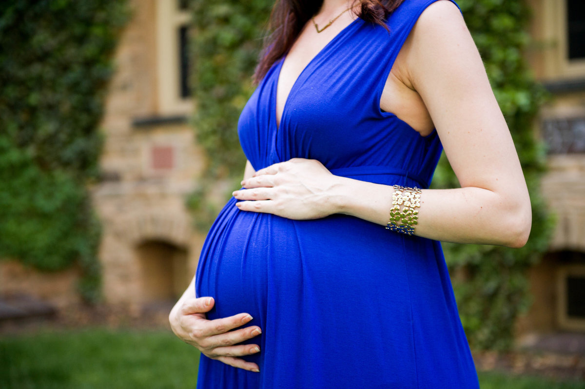 blue maternity dress in front of ivy