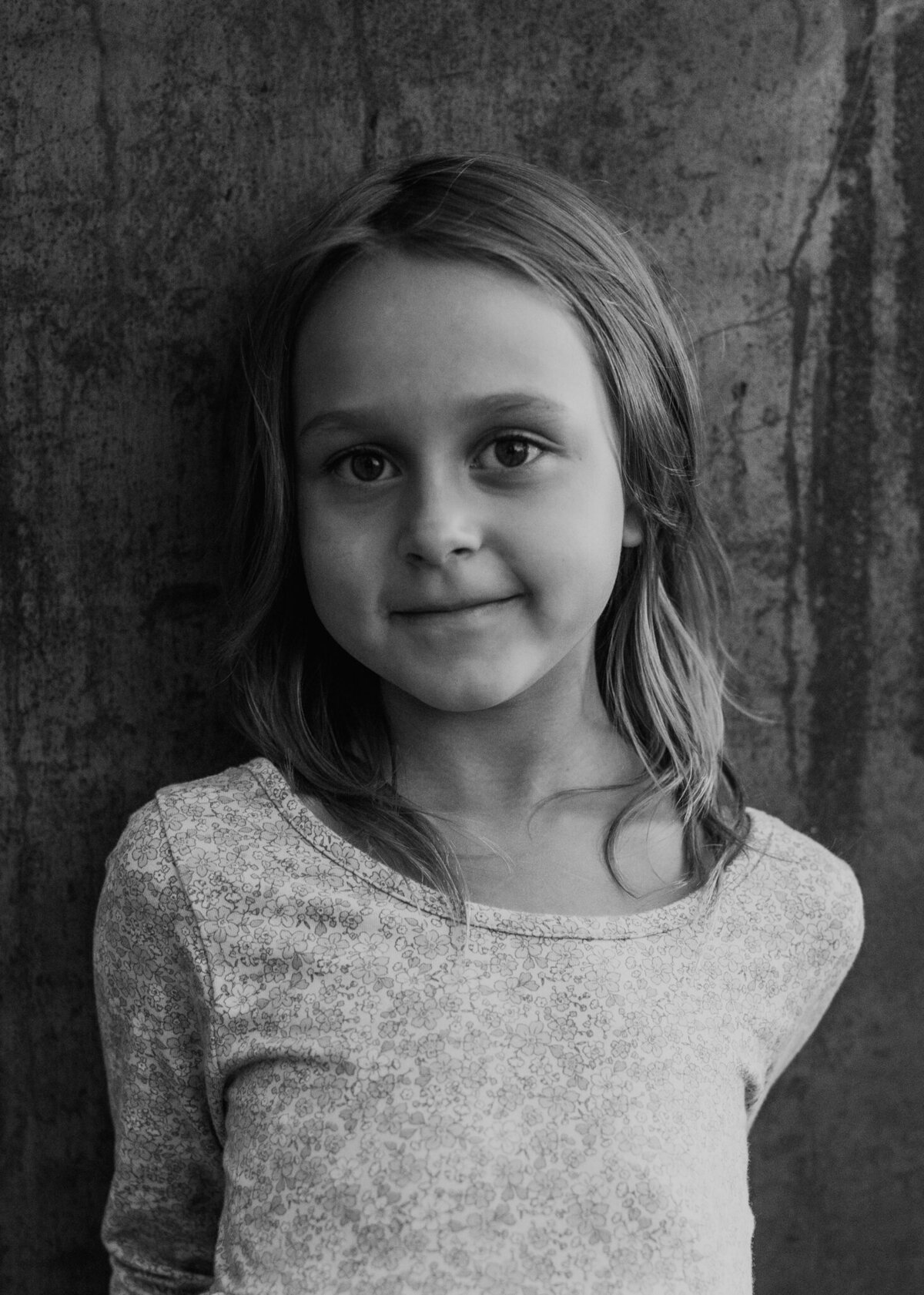 A fine art close-up portrait of a young girl outside on her family's farm.