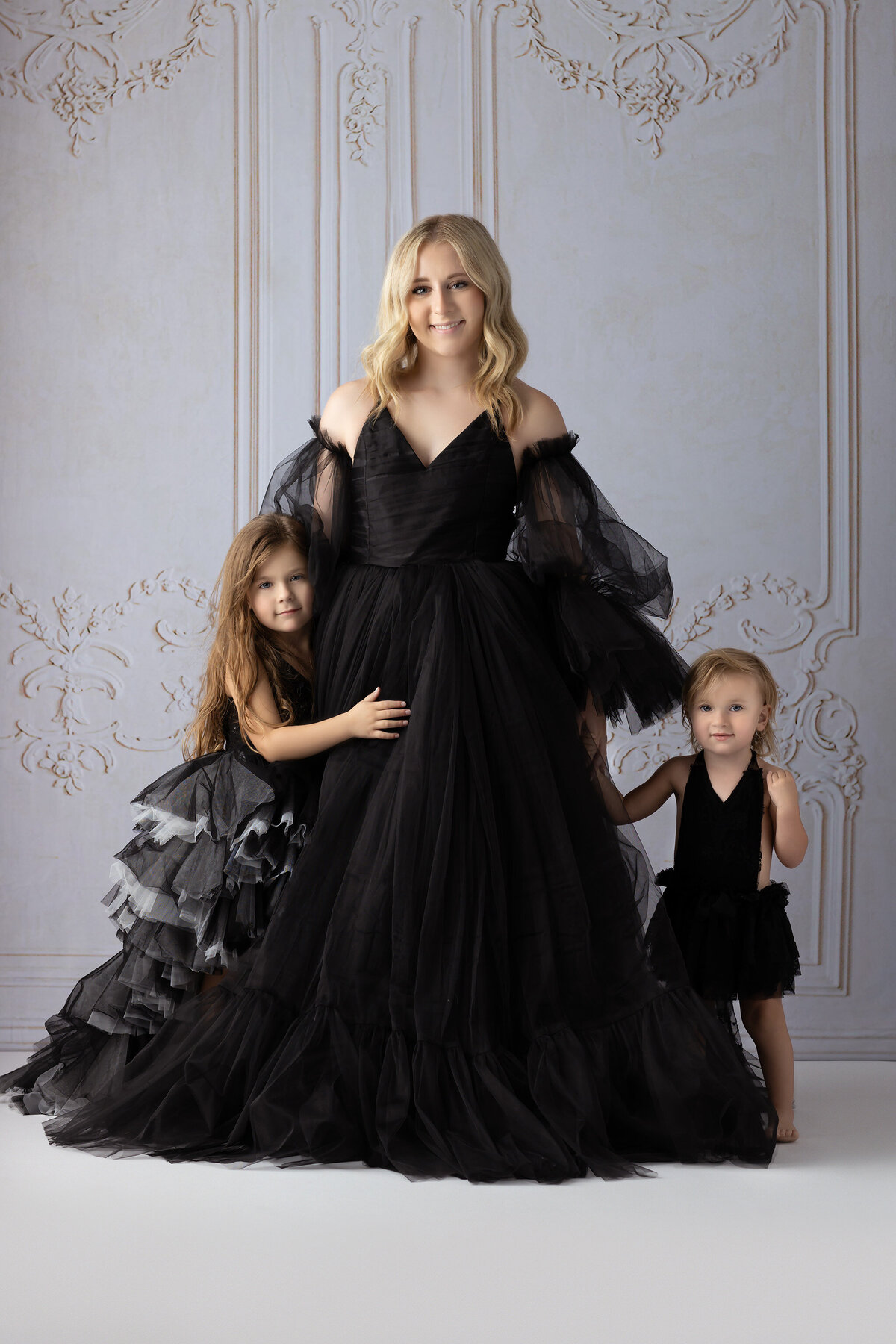 Sisters photo wearing black tulle dresses, styled by Dallas family photographers.
