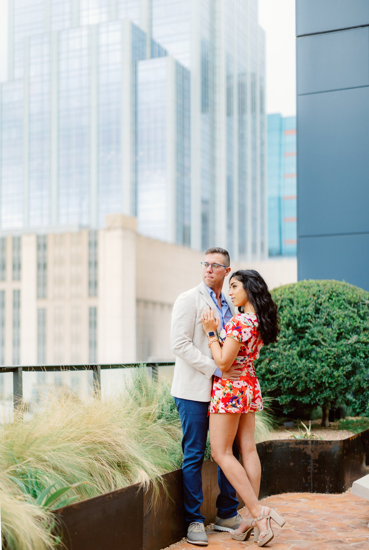 Couple stands on top of building