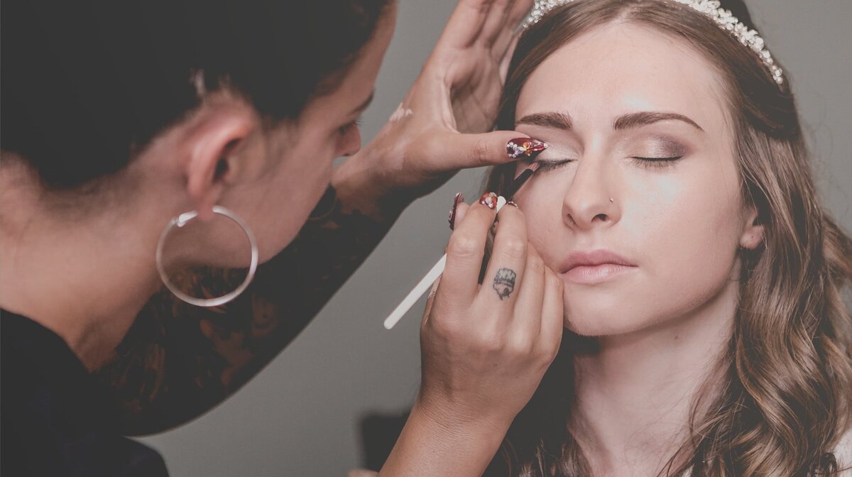 Bride receiving soft glam wedding makeup by Jessica, Connecticut-based makeup artist.