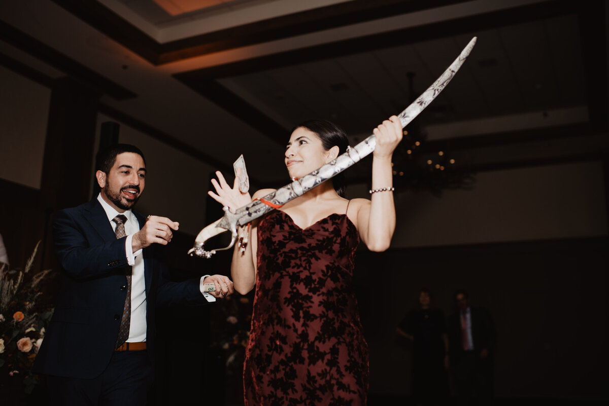 Photographers Jackson Hole capture groom holding sword