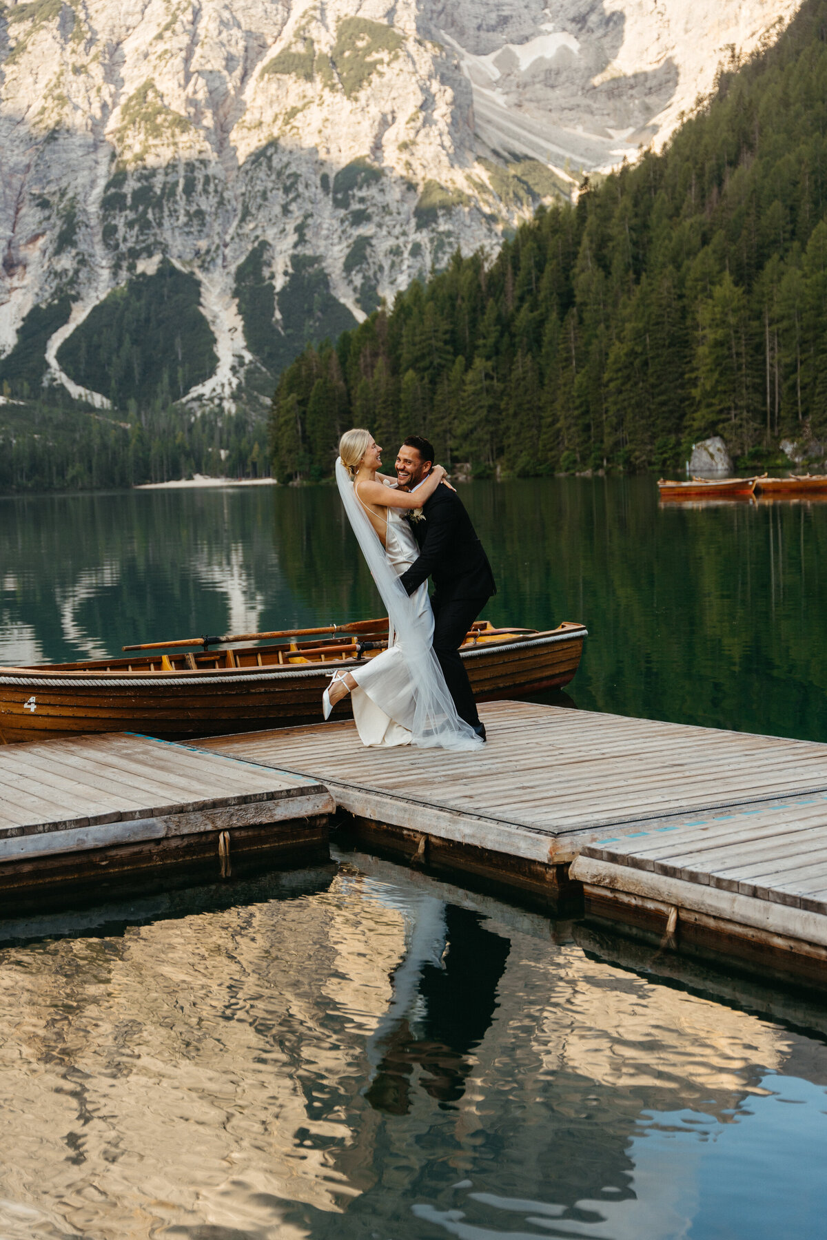 Scenic view of Lago di Braies docks surrounded by mountains