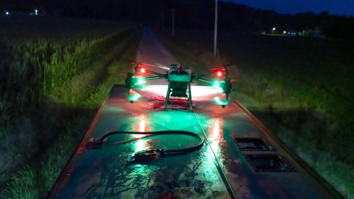 Raven 6 Rising cleaning the top flight deck and their agriculture drones before shutting down for the night.