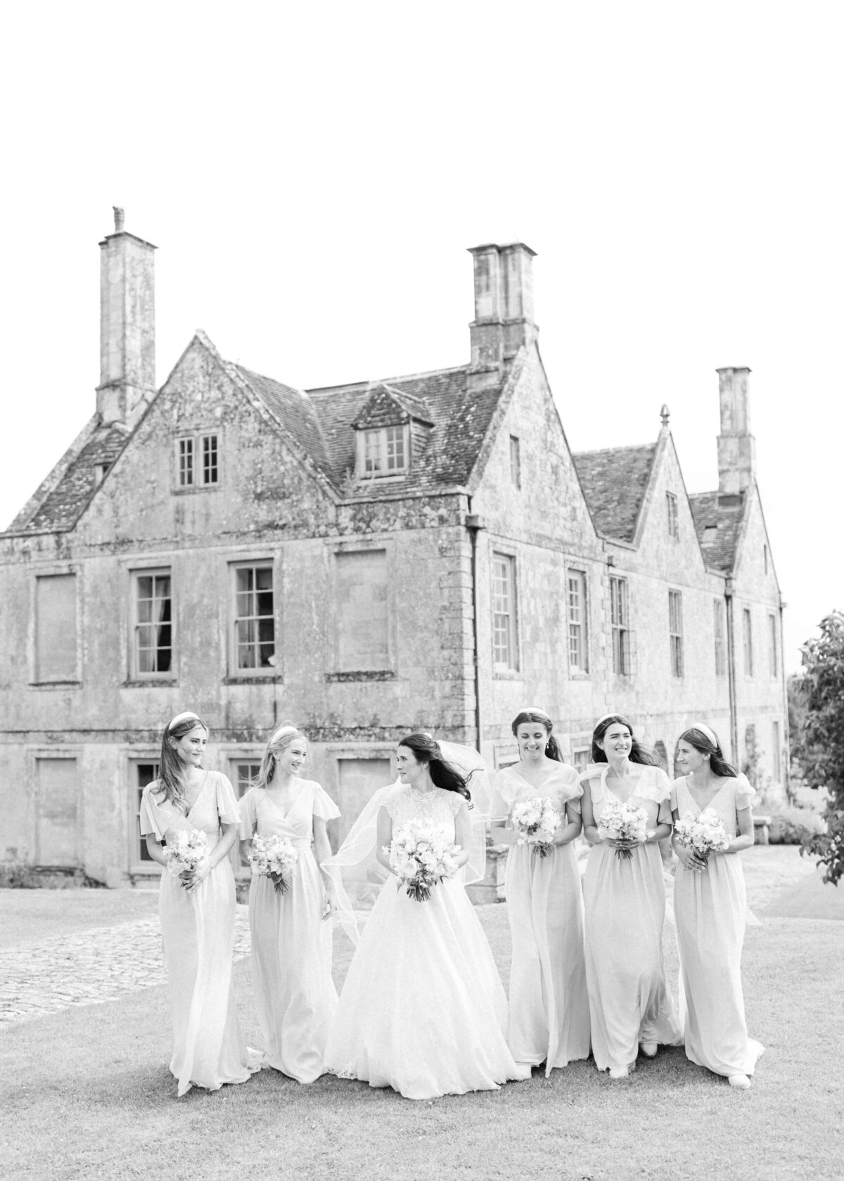 chloe-winstanley-weddings-wiltshire-hatch-house-bridesmaids-walking