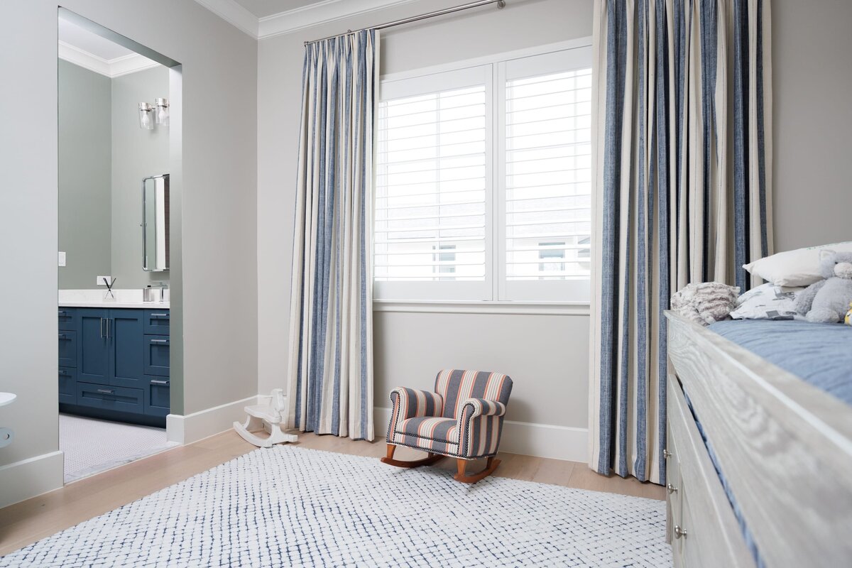 the keeping room interiors primera small chair and rug with blue accents