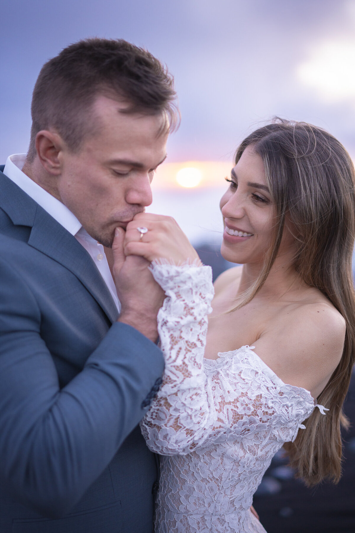 couple-elopement-sunset-kissing-hand