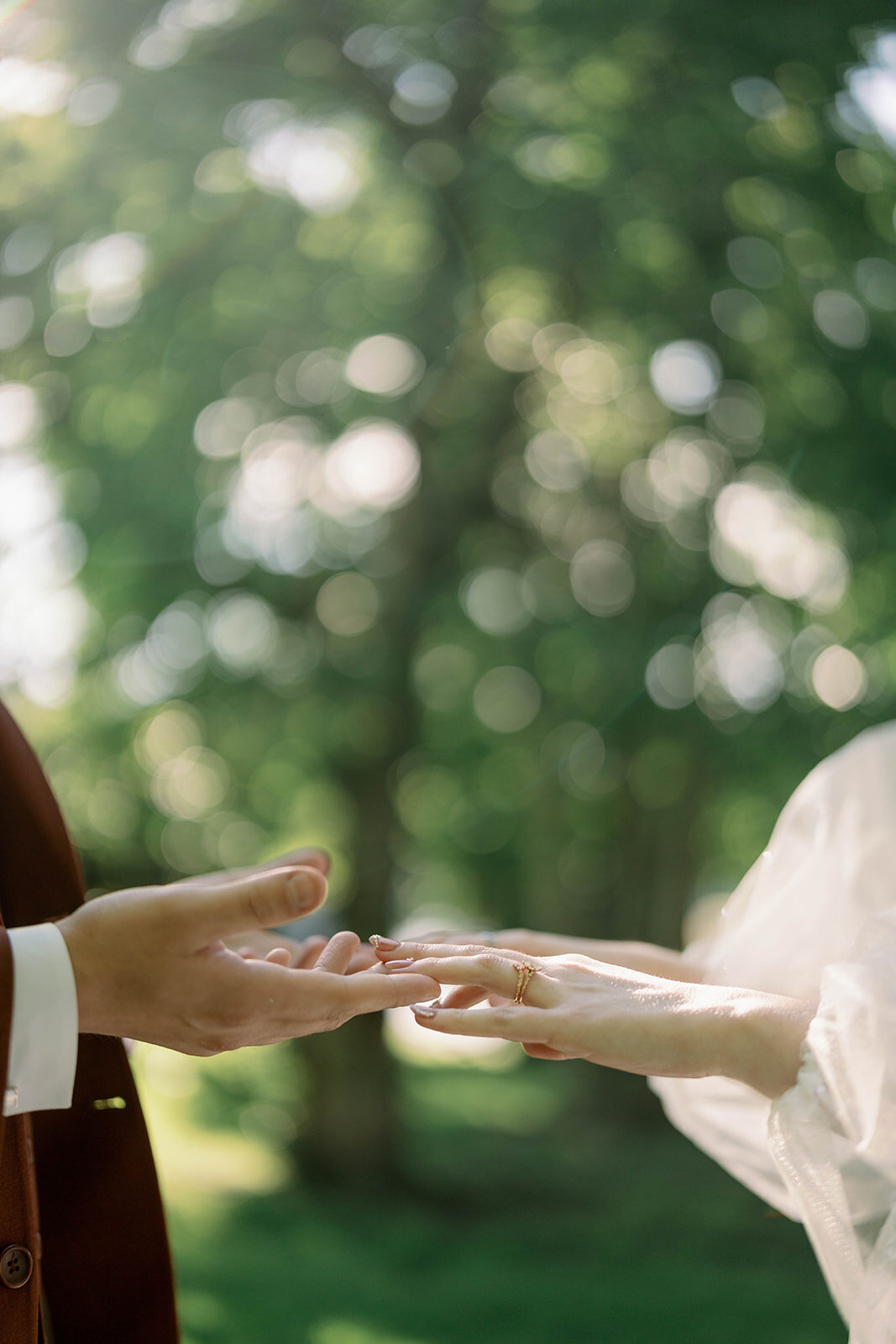 Close-up of couple holding hands during Michigan wedding day