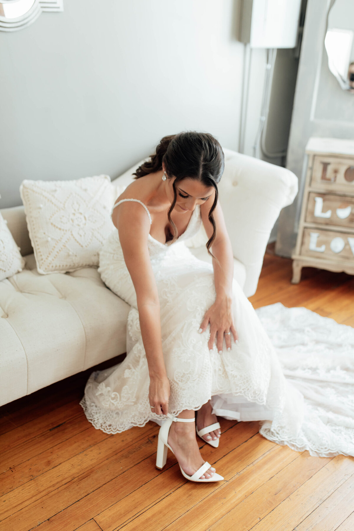 Bride putting on heels. 