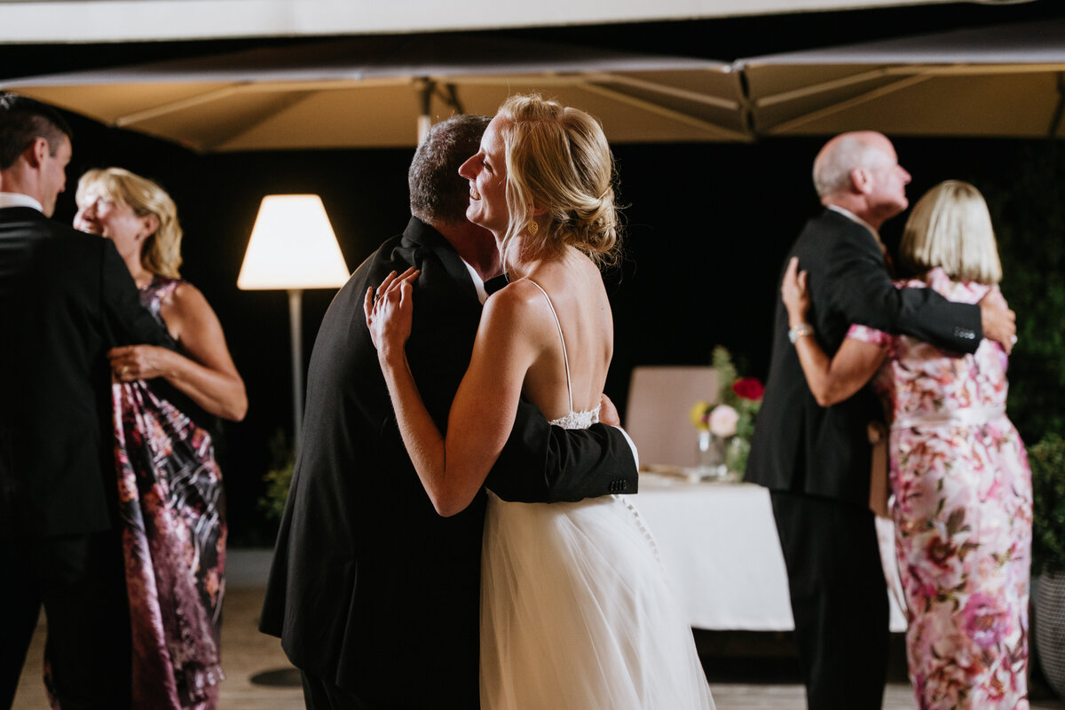 Bride and groom smiling during first dance