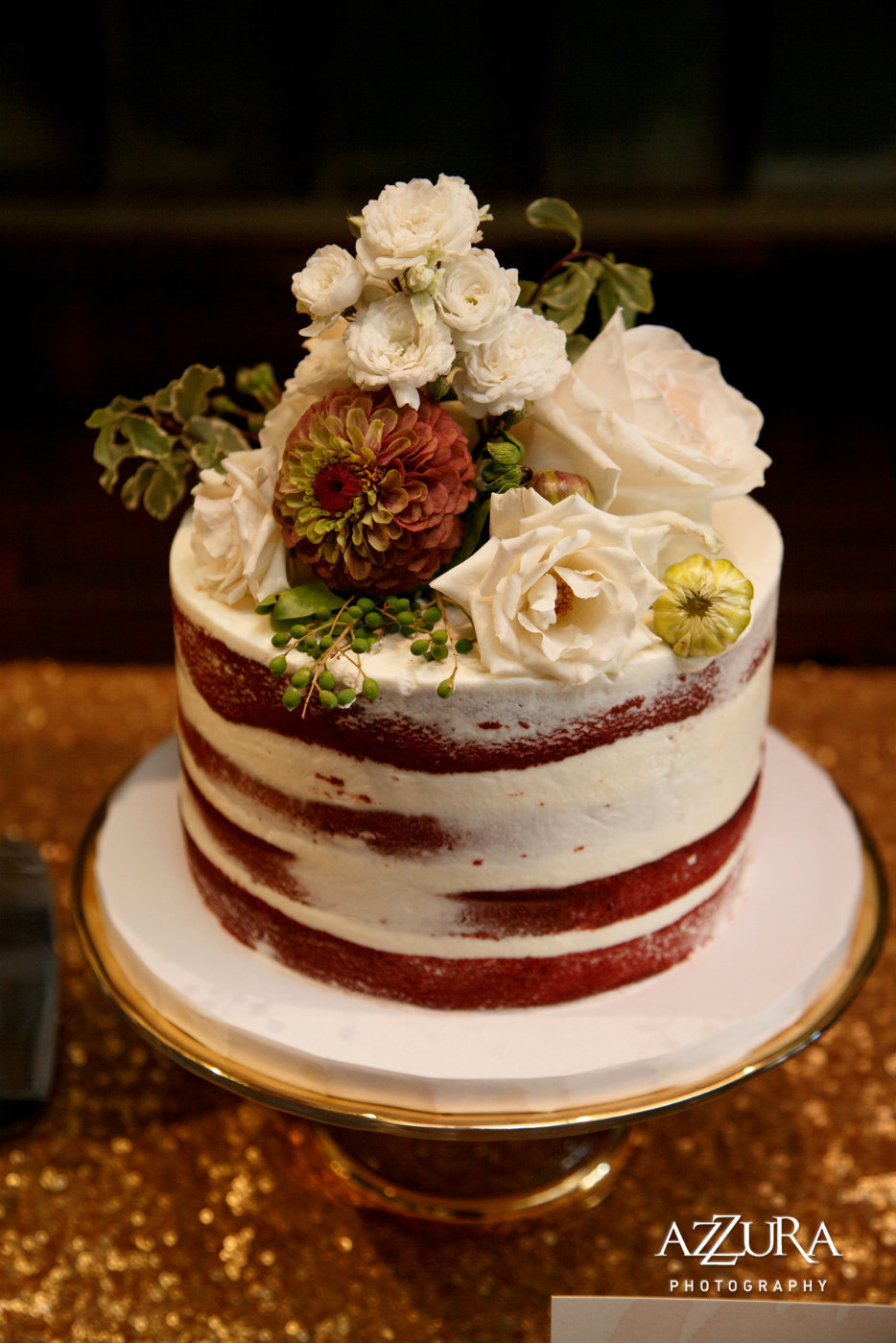 naked wedding cake with fall flowers