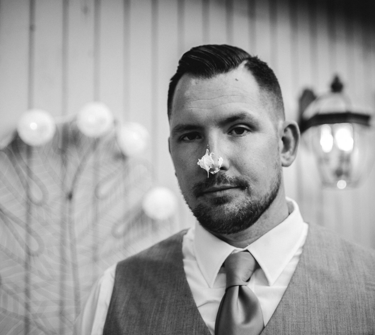 Groom with Wedding Cake on His Nose in Asheville Hendersonville North Carolina by Fort Mill South Carolina Photographer