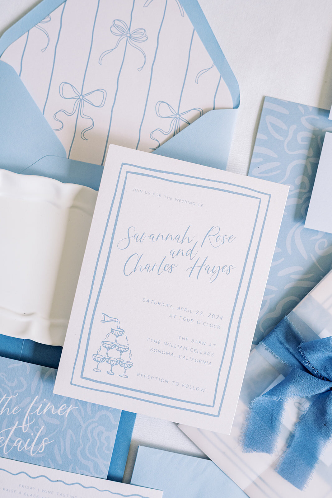 zoomed-in-blue-invite-styled-flatlay