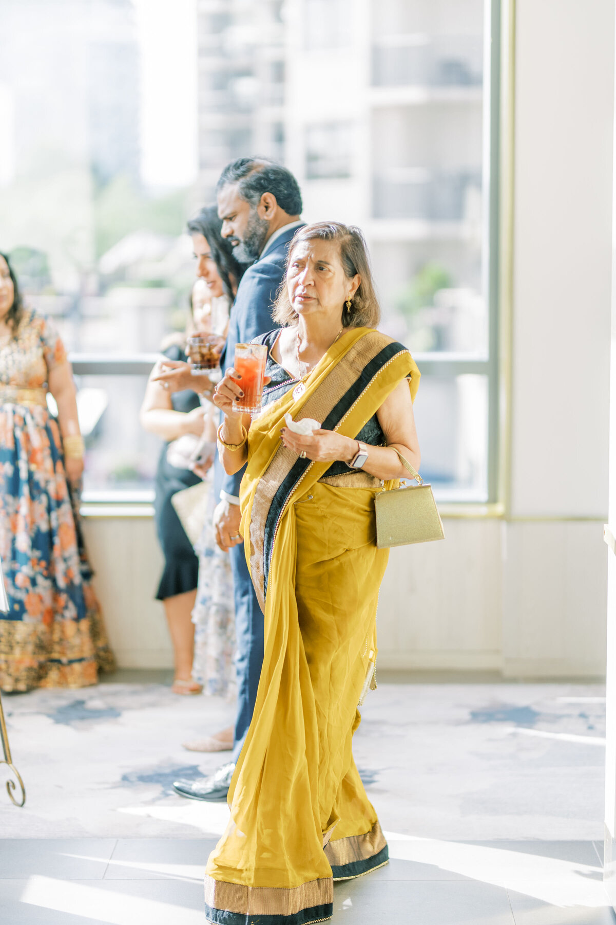 Indian guest watching the couple and excited