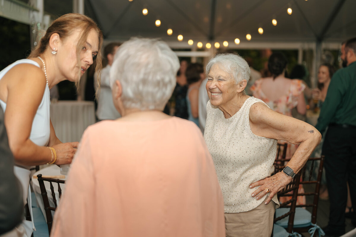 Candid wedding guest moments at a reception at the Groesbeck Estate