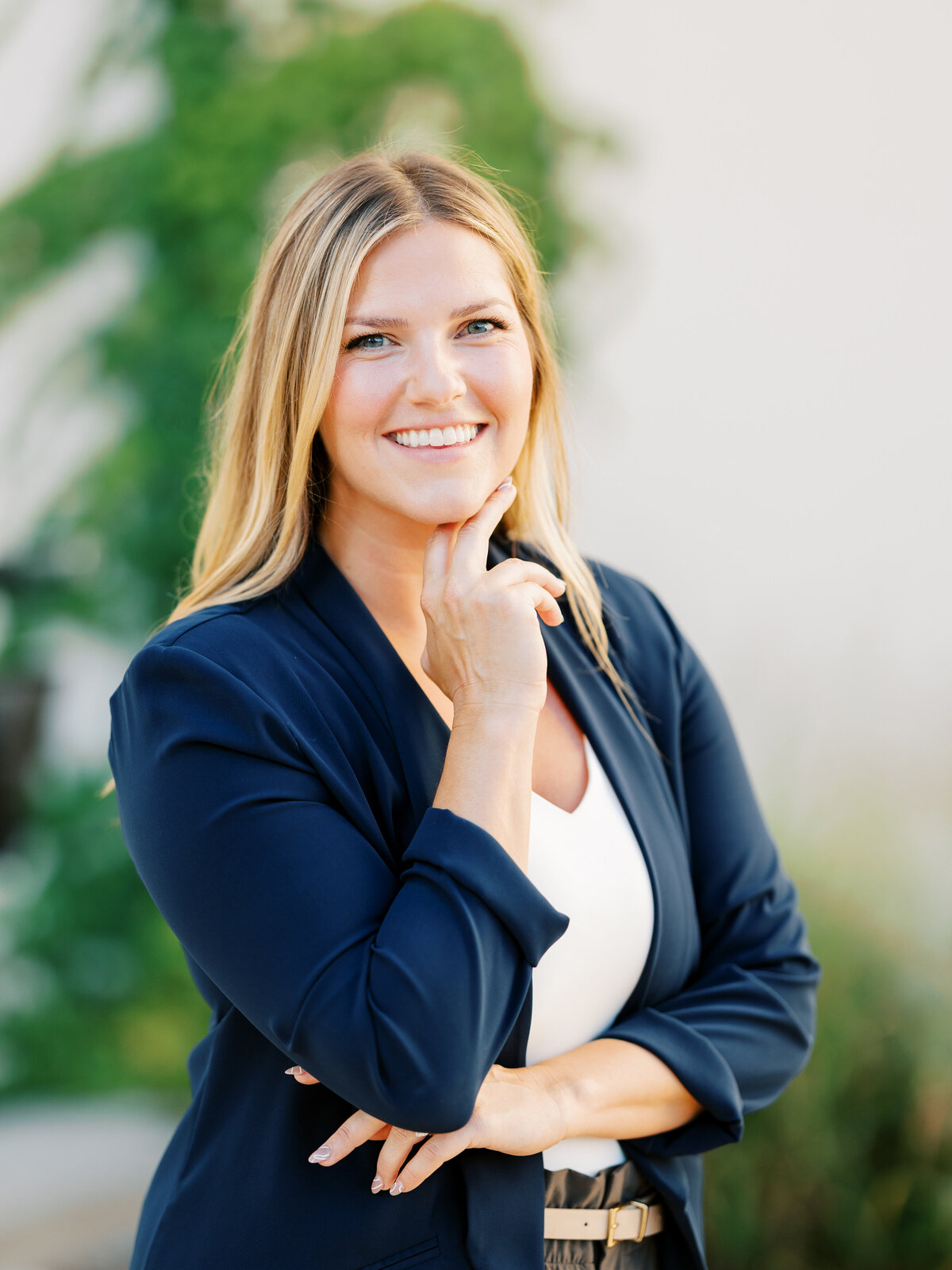 headshot of woman in blue blazer