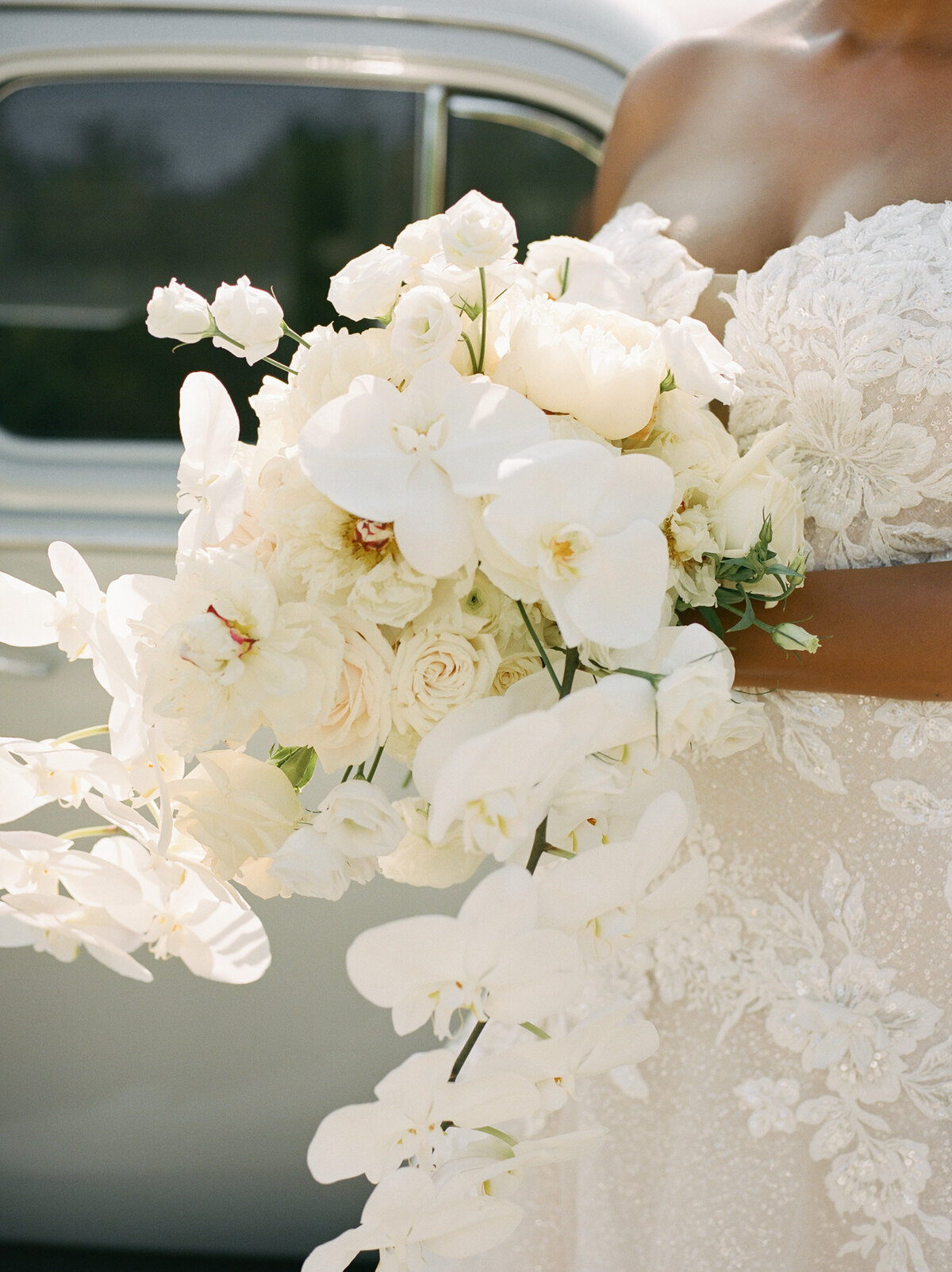 luminous light through an ethereal white orchid bridal bouquet in Detroit, Michigan
