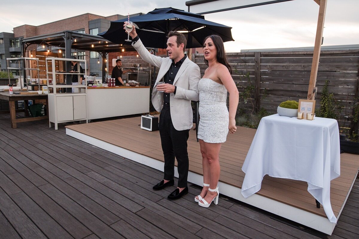 HT-Engagement-Rooftop-Hoboken- Deanna & Jerry toast- (206)