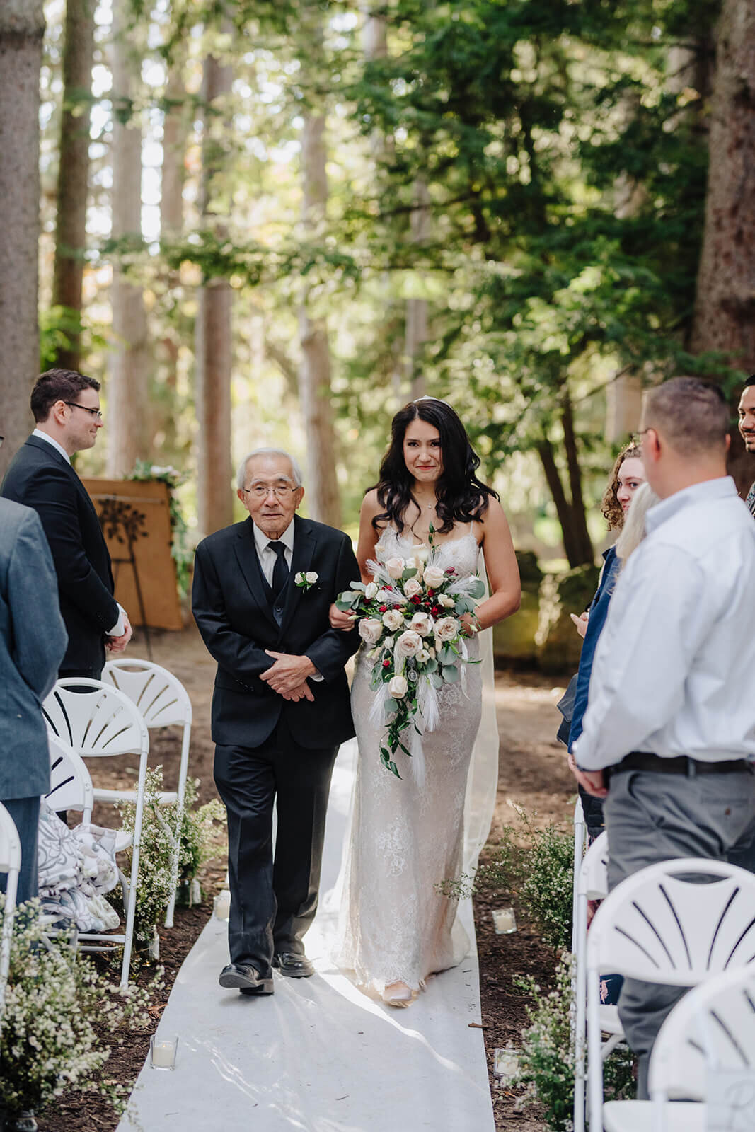 Bride walking down the aisle with her grandfather for her Finger Lakes wedding