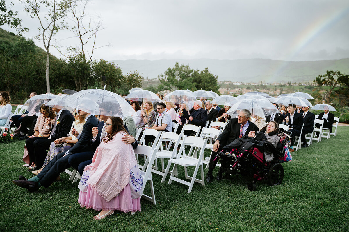 rainbow-and-umbrellas-at-ceremony