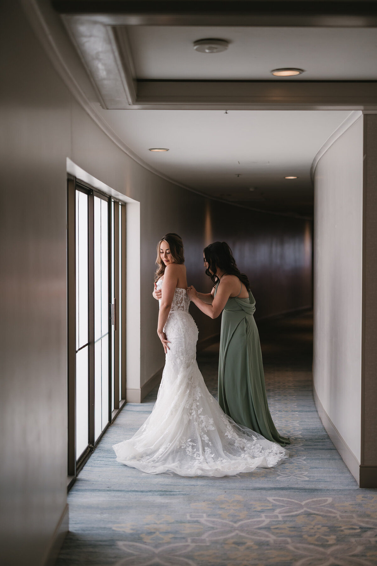 Bride getting ready for wedding at Hilton Beachfront Resort Santa Barbara