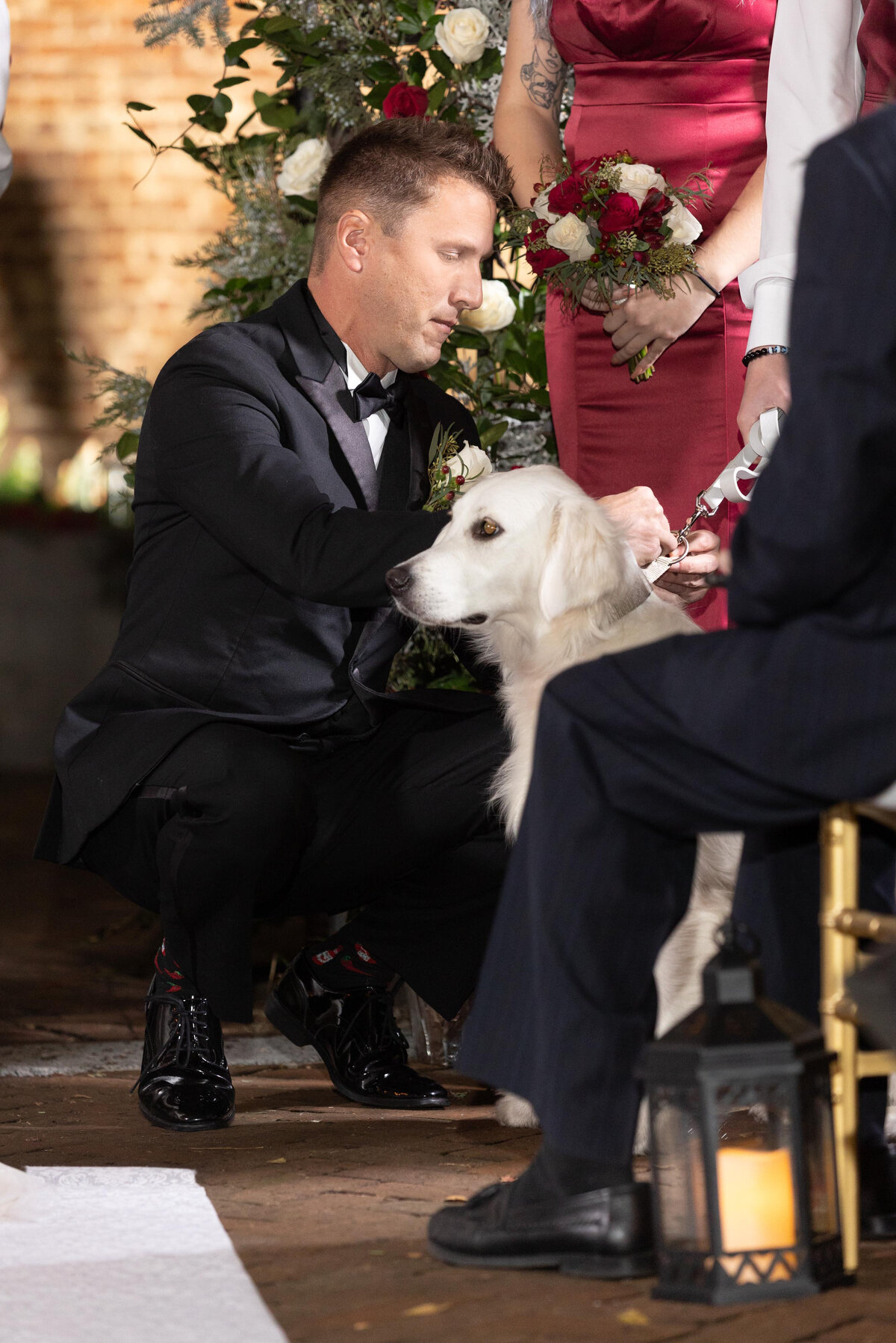 Chip takes the wedding ring for his bride from his dog, the ring bearer at his wedding.