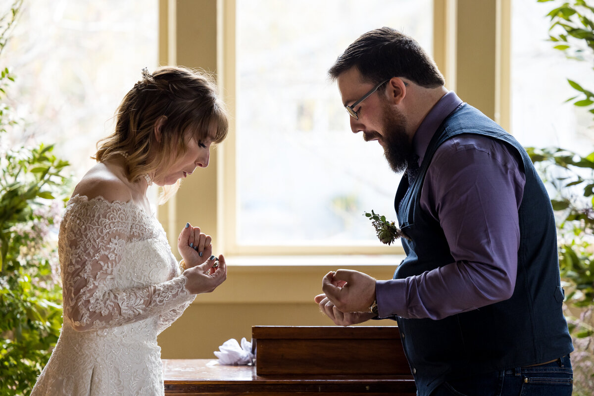 wedding-bride-groom-ceremony-ring-drop-candid-post-falls