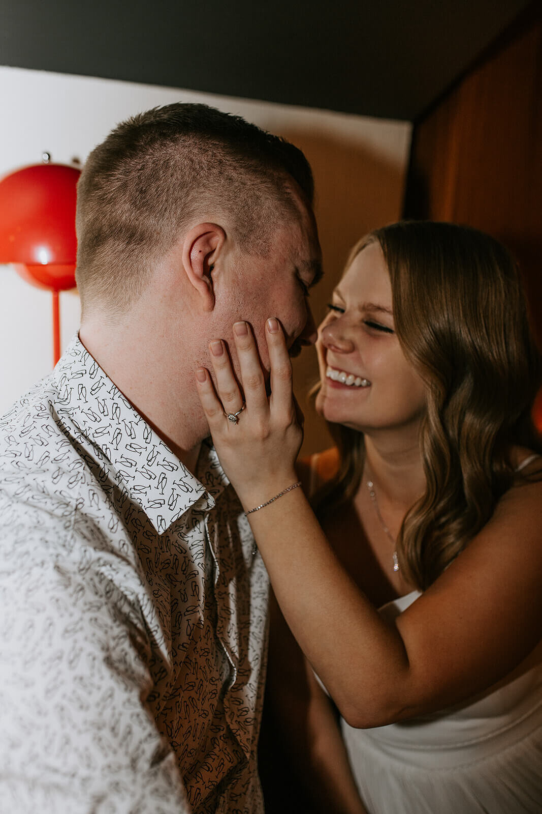 Woman-holds-mans-face-smiling