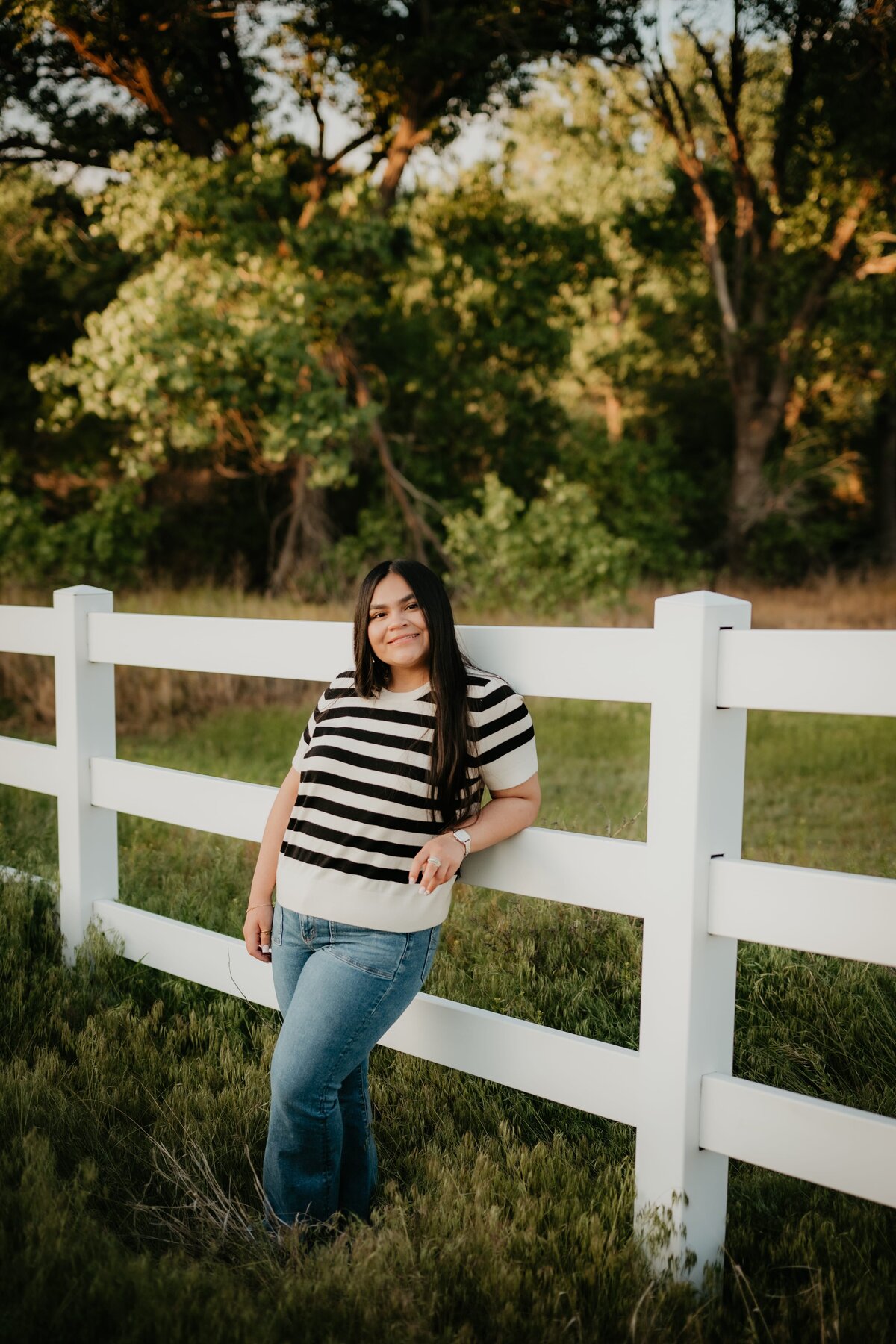 senior leaning on fence, amarillo, texas senior photography