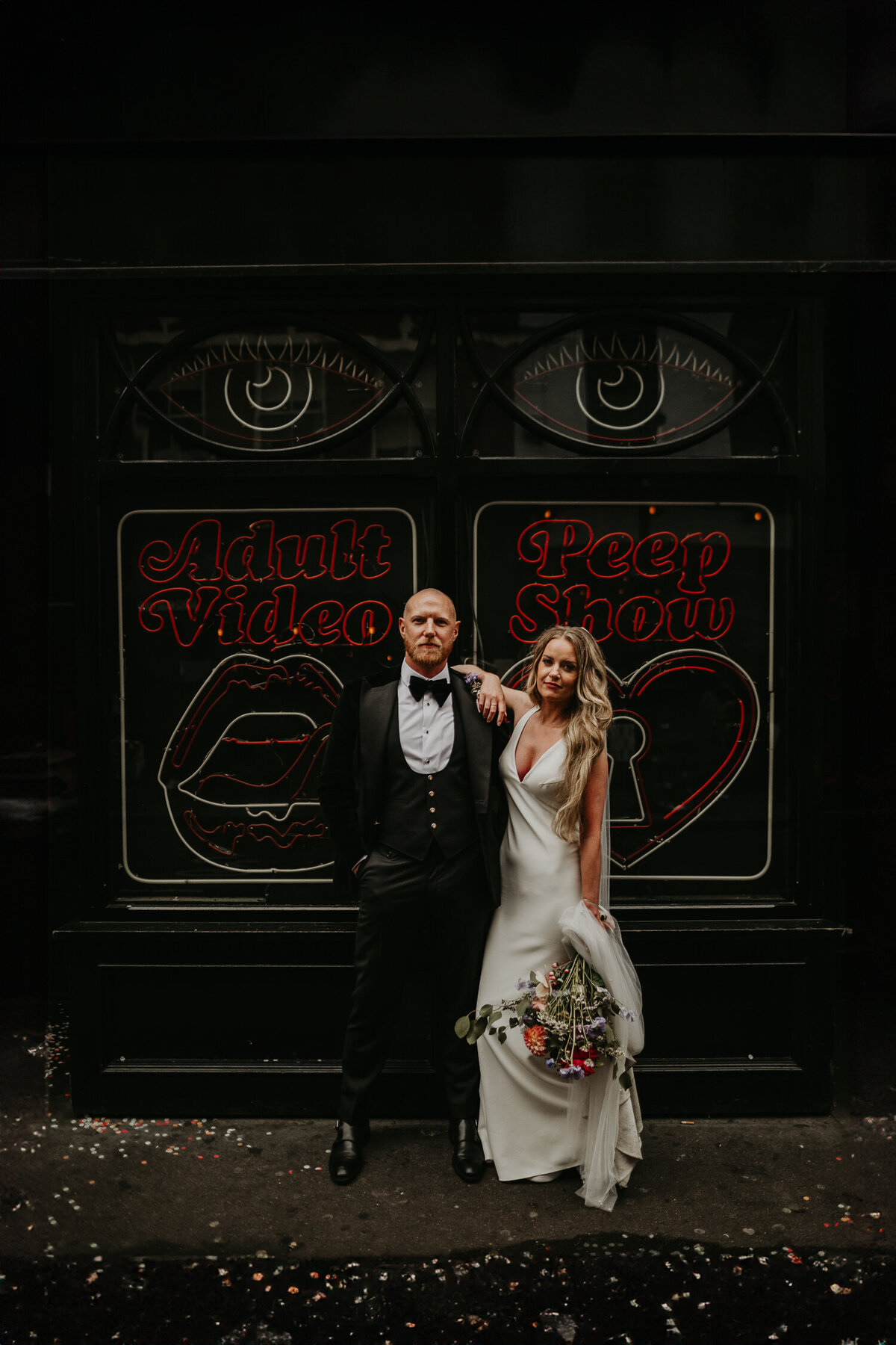 Wedding couple walk around soho on their wedding day.