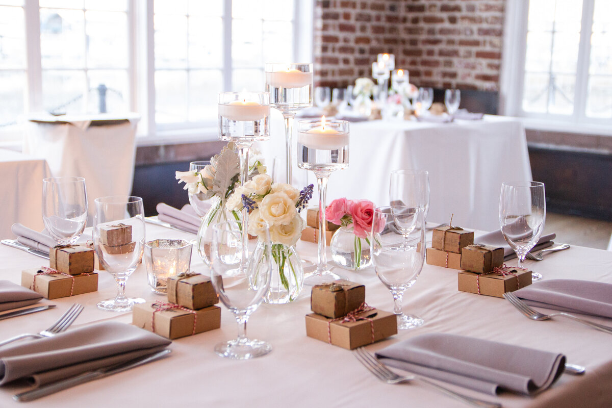 reception table detail with brick walls by wedding photographer in Texas