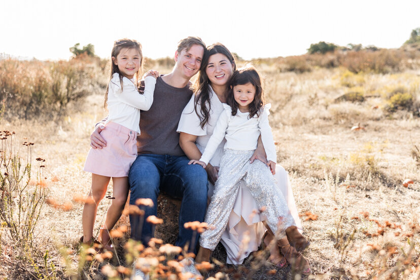 family-of-four-sitting-on-rock-wrights-field-san-diego