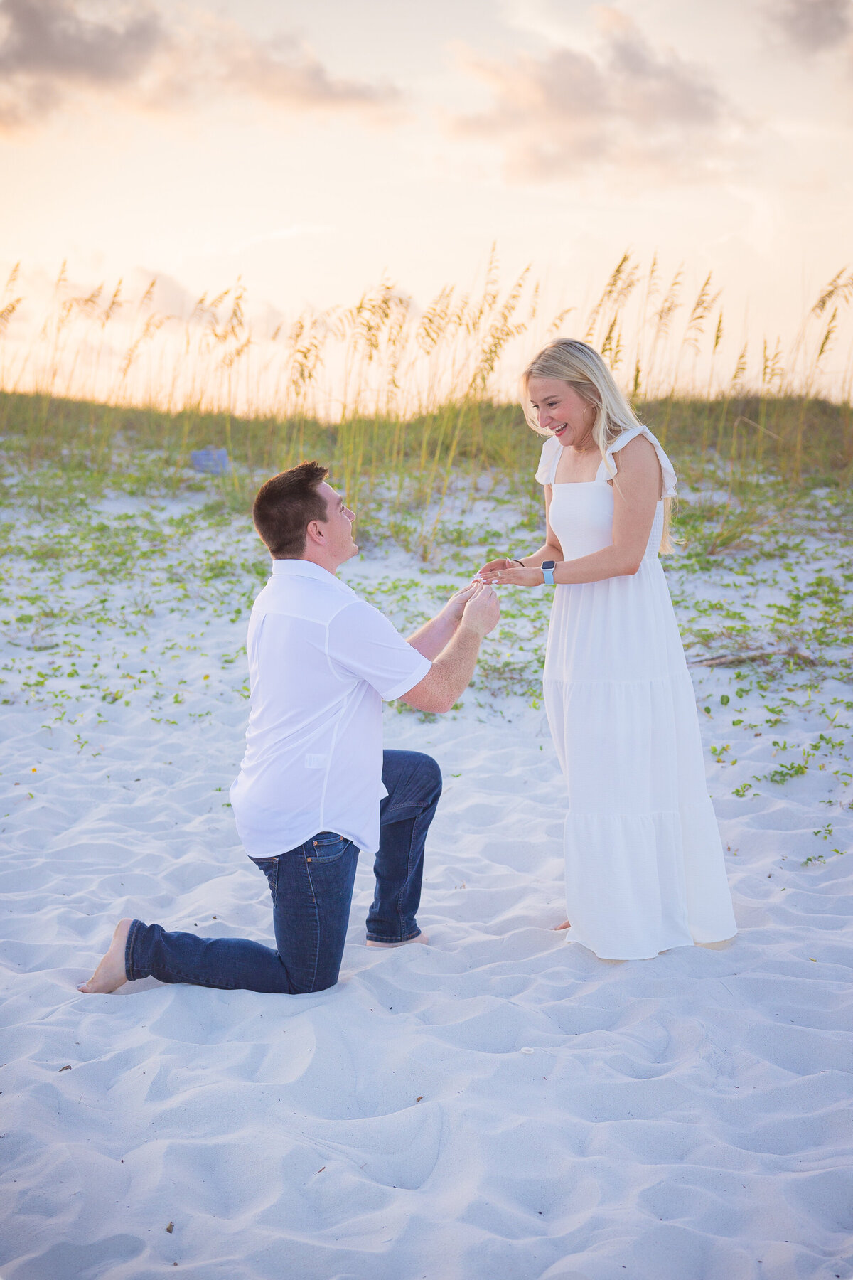 man presenting ring to girlfriend