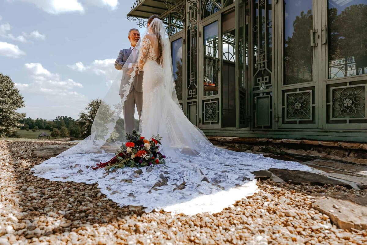 Tampa Wedding photographers capture bride with cathedral length vail
