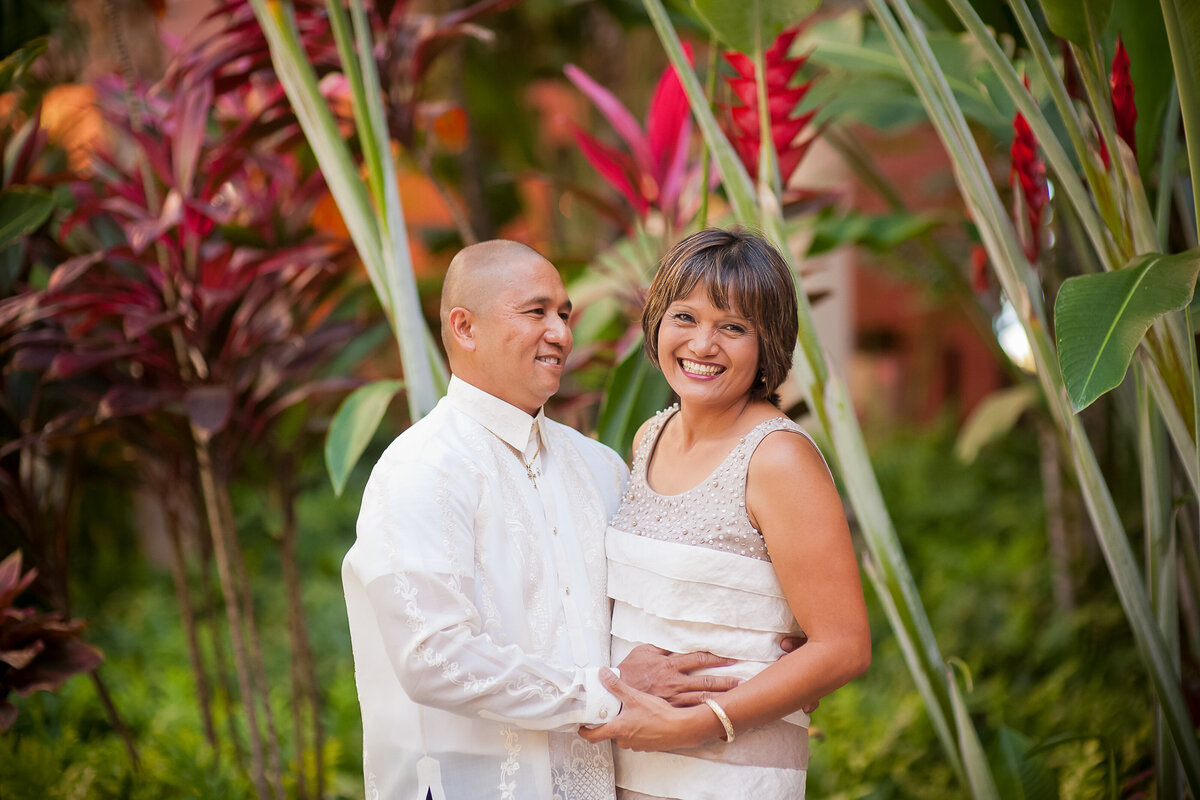 Husband and Wife Pose for a Photo at the Royal Hawaiian Hotel