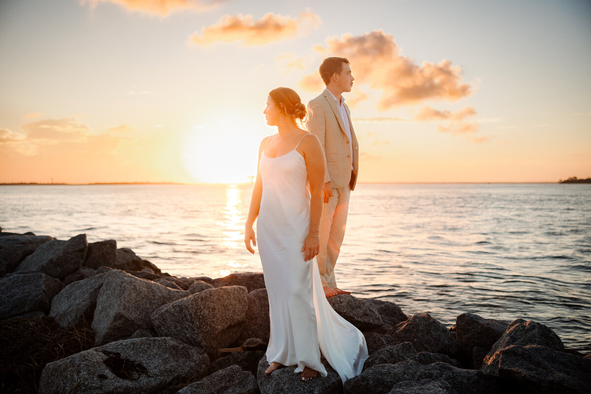 Couple posing during a beach elopement in St. Augustine, Florida.