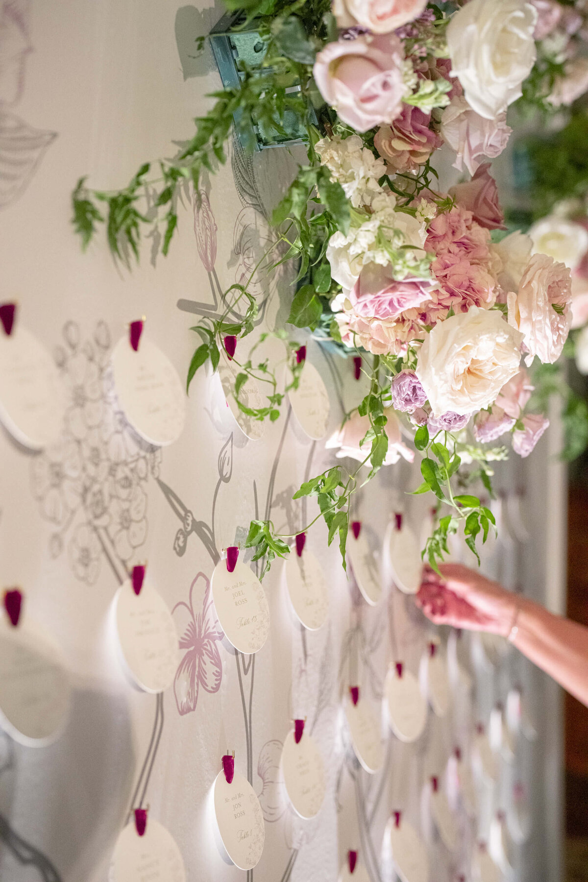 Wedding guest holding their escort card for a wedding in Dallas, texas