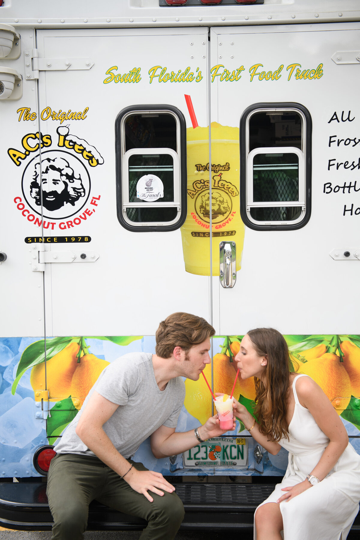 A couple enjoys a frozen treat from a popular food truck in South Florida.