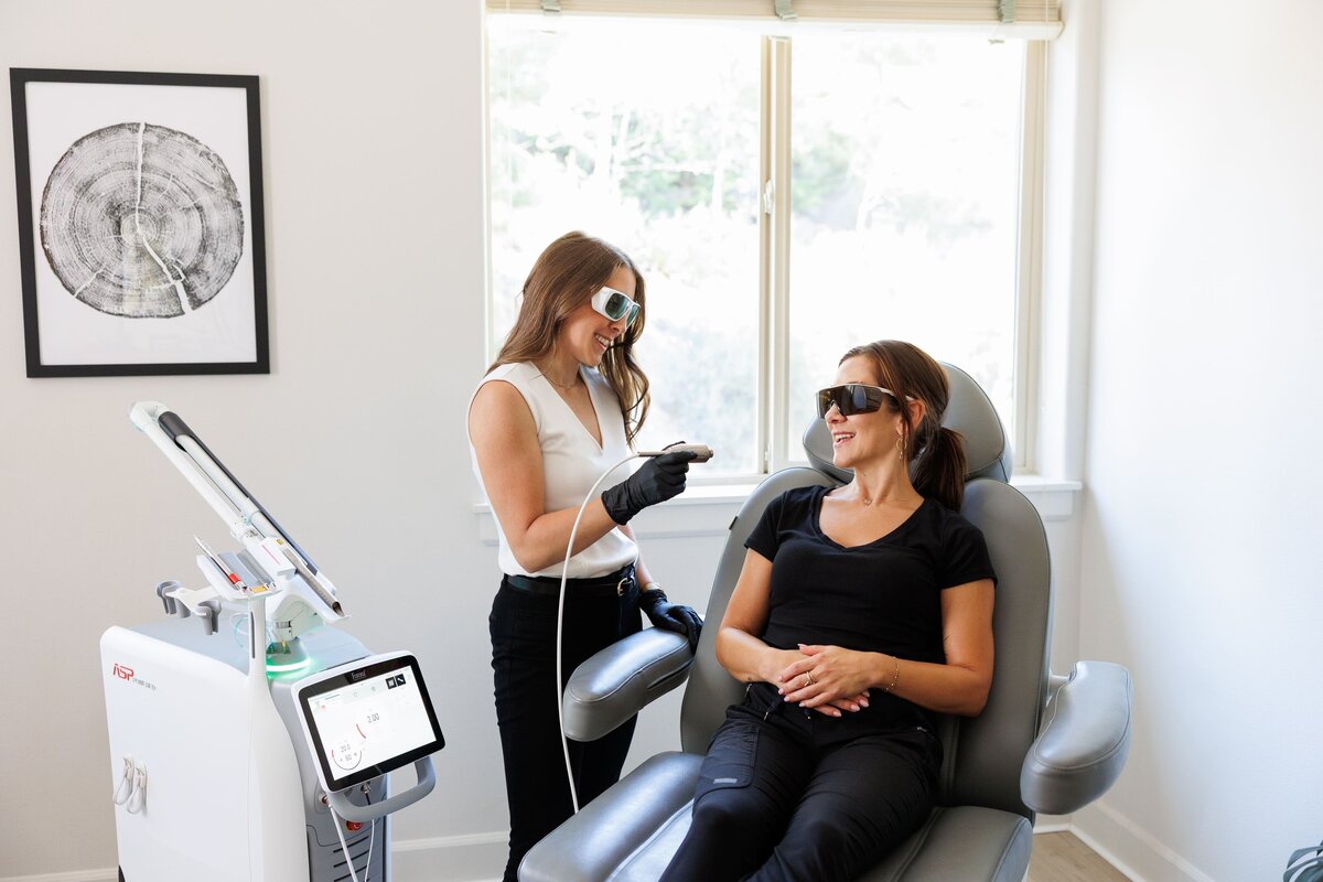 A branding photo of an expert at work, engaging with her client.