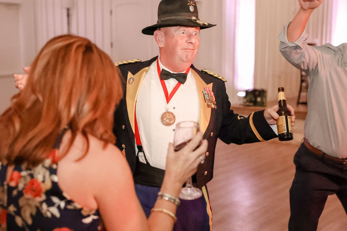 military wedding father of the bride dances in uniform