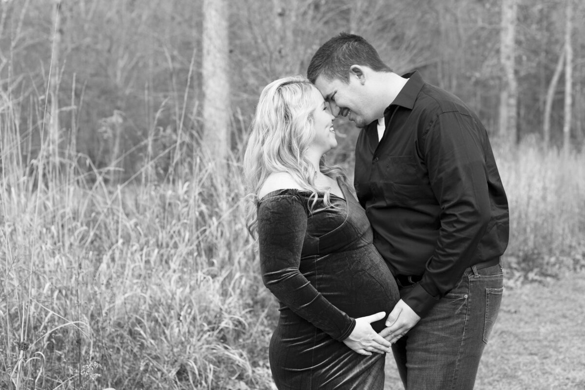 Parents maternity photography holding belly Asheville NC The NC Arboretum