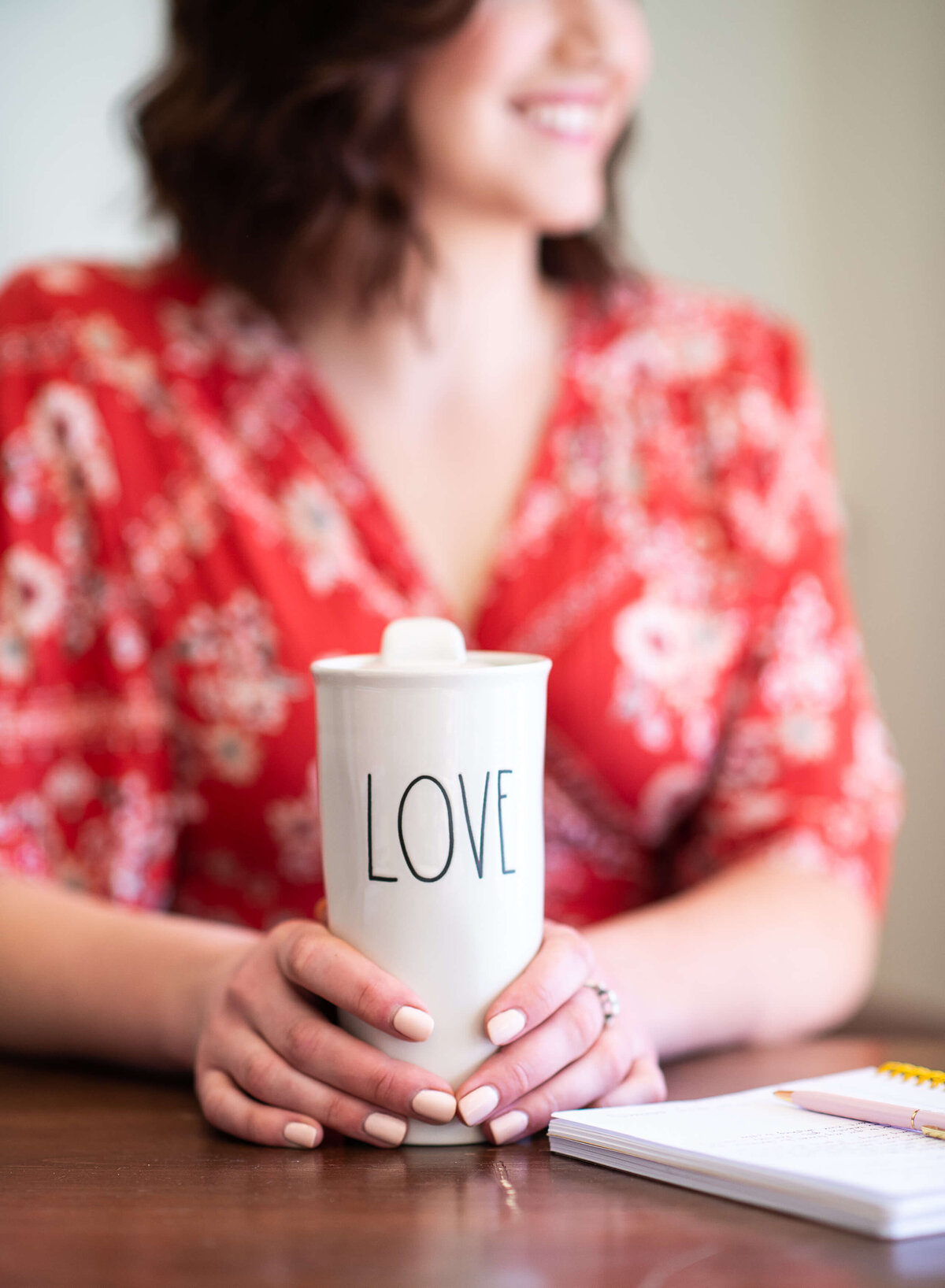 Ottawa brand photos of a ceramic mug with the word love on it