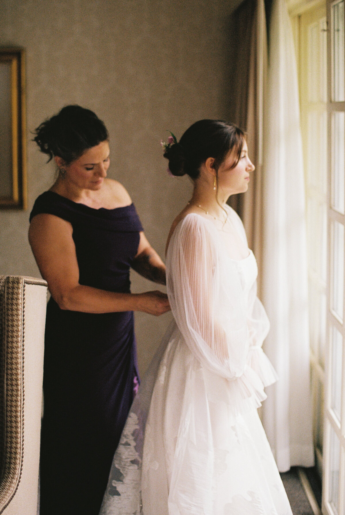 mom putting on dress