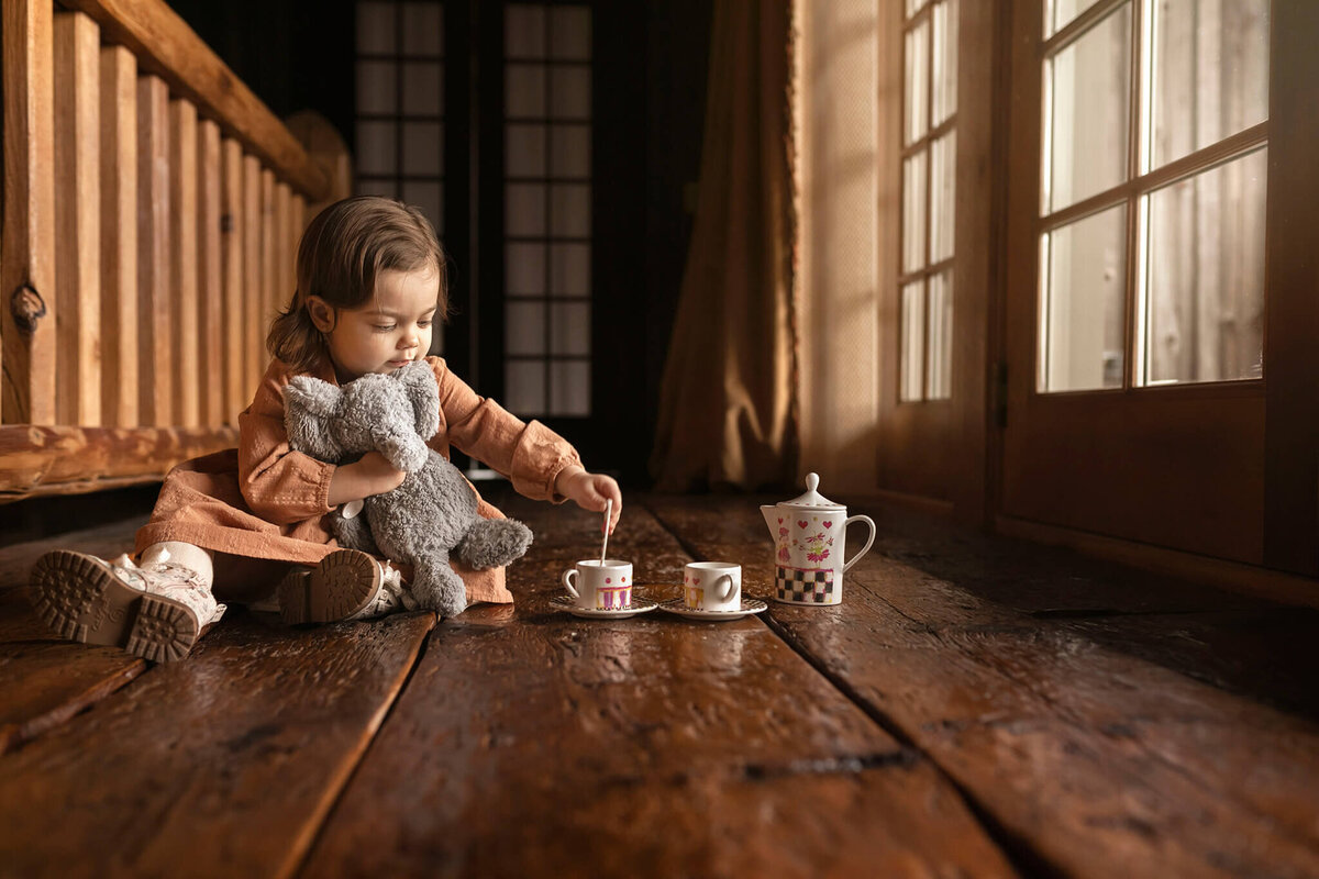 NJ family photos of little girl with tea set