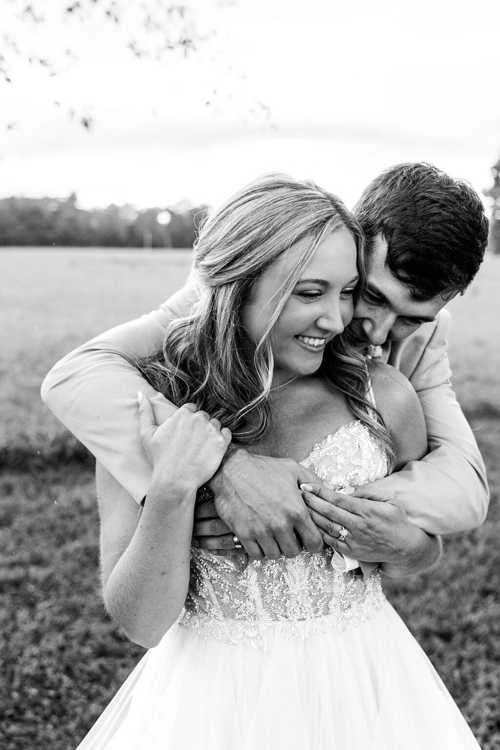 Photog of bride and groom hugging